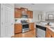 Well-equipped kitchen with stainless steel appliances, granite countertops, and plenty of cabinet storage space at 946 Consortium Dr, Raleigh, NC 27603