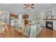 Cozy living room featuring hardwood floors, a fireplace, and an open layout connecting to the kitchen at 946 Consortium Dr, Raleigh, NC 27603