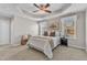 Comfortable main bedroom boasts a tray ceiling, plush carpeting, and bright windows with natural light at 946 Consortium Dr, Raleigh, NC 27603