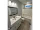 Neutral toned bathroom with granite countertop vanity and shower-tub combination at Lot 14H Good Shepherd Trl, Spring Hope, NC 27882