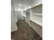 Walk-in closet with carpet, wood bars for hanging clothes, and some shelving at Lot 14H Good Shepherd Trl, Spring Hope, NC 27882