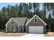 Charming single-Gathering home with stone and siding, two-car garage, and a well-maintained lawn at Lot 14H Good Shepherd Trl, Spring Hope, NC 27882