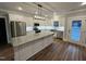 Modern kitchen featuring stainless steel appliances, granite countertops, and a center island at Lot 14H Good Shepherd Trl, Spring Hope, NC 27882