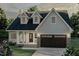 Charming two-story home with dormer windows and a two-car garage, complemented by a well-manicured front lawn and inviting curb appeal at Lot 15H Good Shepherd Trl, Spring Hope, NC 27882