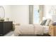 Bright bedroom with decorative cloud accents, chic furniture, and a calming aesthetic at 1004 Red Roses Ave, Durham, NC 27703