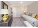 Cozy bedroom featuring a daybed, dresser, and warm lighting to create a relaxing atmosphere at 1005 Red Roses Ave, Durham, NC 27703