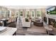 Bright living room featuring hardwood floors, fireplace, and ample natural light with adjacent dining room at 1005 Red Roses Ave, Durham, NC 27703