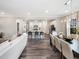 Open-concept living space with kitchen, dining area, and living room providing a flowing layout at 1005 Red Roses Ave, Durham, NC 27703