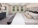Relaxing main bedroom with a comfortable bed, natural light, and stylish decor at 1005 Red Roses Ave, Durham, NC 27703