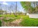 Green backyard featuring several storage sheds at 1022 Glover Rd, Dunn, NC 28334
