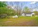 Sprawling backyard with sheds and fenced perimeter at 1022 Glover Rd, Dunn, NC 28334