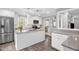 Modern kitchen featuring white cabinets, stainless steel appliances, and granite countertops at 1022 Glover Rd, Dunn, NC 28334
