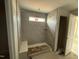 Walk-in shower with tile surround and built-in bench at 104 Fairwinds Dr, Lillington, NC 27546
