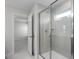 Bathroom featuring a glass-enclosed shower and light tile work at 104 Fairwinds Dr, Lillington, NC 27546