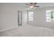 This bedroom has neutral walls, carpet floors, three windows for natural light, and a closet at 104 Fairwinds Dr, Lillington, NC 27546