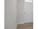 Bright entryway featuring a white door and hardwood flooring at 104 Fairwinds Dr, Lillington, NC 27546