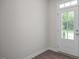 Entryway with natural light and hardwood floors and paneled front door at 104 Fairwinds Dr, Lillington, NC 27546