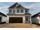 New construction two story home with attached garage and neutral color palette at 104 Fairwinds Dr, Lillington, NC 27546