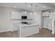 Open concept kitchen with island and stainless steel appliances at 104 Fairwinds Dr, Lillington, NC 27546
