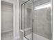 Full glass walk-in shower with bench seat and small window to let the light in at 104 Fairwinds Dr, Lillington, NC 27546
