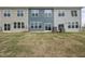 Townhome back exterior with sliding glass doors at 104 Ripple Way # 318, Clayton, NC 27520