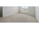 Spacious bedroom featuring neutral paint, carpet flooring, natural light, and a walk-in closet at 104 Ripple Way # 318, Clayton, NC 27520