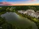 Scenic aerial of residential multi-Gathering homes near a tranquil lake with a fountain and wooded surroundings at 10400 Rosegate Ct # 3, Raleigh, NC 27617