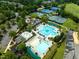 Aerial view of tennis courts and multiple community pools, playgrounds and clubhouse at 10400 Rosegate Ct # 3, Raleigh, NC 27617