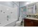 Clean bathroom with vanity, tub and shower combination and tiled walls at 10400 Rosegate Ct # 3, Raleigh, NC 27617