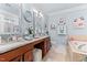 Well-appointed bathroom with double vanity, marble countertops, and a separate soaking tub at 10400 Rosegate Ct # 3, Raleigh, NC 27617