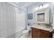 Bathroom with a shower and tub combination, granite counter, and classic fixtures at 10400 Rosegate Ct # 3, Raleigh, NC 27617