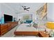 Comfortable main bedroom featuring a large bed, contemporary furnishings, and a ceiling fan at 10400 Rosegate Ct # 3, Raleigh, NC 27617