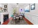 Modern dining area with glass table, cozy rug and a view to the outdoor balcony at 10400 Rosegate Ct # 3, Raleigh, NC 27617