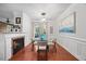 Inviting dining room with fireplace, glass table and four chairs at 10400 Rosegate Ct # 3, Raleigh, NC 27617