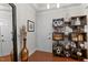 Stylish entryway showcasing wooden floors and decorative shelves with glass and metal accessories at 10400 Rosegate Ct # 3, Raleigh, NC 27617