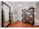 Charming foyer with hardwood floors, decorative shelving and statement mirror at 10400 Rosegate Ct # 3, Raleigh, NC 27617