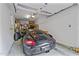 A well-lit garage featuring a sleek, black Porsche with storage and organization around the perimeter at 10400 Rosegate Ct # 3, Raleigh, NC 27617