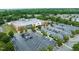 Aerial view of a grocery store exterior and parking lot in a well-landscaped business area at 10400 Rosegate Ct # 3, Raleigh, NC 27617