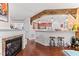 Open floor plan kitchen with brick accents and barstool seating at 10400 Rosegate Ct # 3, Raleigh, NC 27617