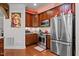 Gourmet kitchen featuring stainless steel appliances, stone countertops, and custom wood cabinetry at 10400 Rosegate Ct # 3, Raleigh, NC 27617