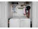 Laundry room with a full sized washer, a full sized dryer, and storage shelves at 10400 Rosegate Ct # 3, Raleigh, NC 27617