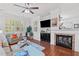 Bright living room featuring a fireplace, hardwood floors and natural light at 10400 Rosegate Ct # 3, Raleigh, NC 27617