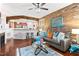Open living space with exposed brick, fireplace and kitchen view at 10400 Rosegate Ct # 3, Raleigh, NC 27617