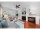 Cozy living room with comfortable seating and a brick fireplace at 10400 Rosegate Ct # 3, Raleigh, NC 27617
