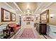 Inviting lobby featuring elegant furnishings, decorative artwork and carpet in a modern residential setting at 10400 Rosegate Ct # 3, Raleigh, NC 27617