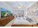 Main bedroom featuring a large television, decorative trim, and contemporary furnishings at 10400 Rosegate Ct # 3, Raleigh, NC 27617
