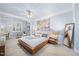 Spacious main bedroom with light blue walls, decorative trim, and contemporary furnishings at 10400 Rosegate Ct # 3, Raleigh, NC 27617