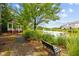 Charming pond view featuring a gazebo, serene water, and natural landscaping for relaxation at 10400 Rosegate Ct # 3, Raleigh, NC 27617