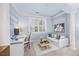 Sitting area adjacent to a bedroom space that features a comfortable couch, desk, and large windows at 10400 Rosegate Ct # 3, Raleigh, NC 27617