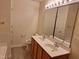 Well-lit bathroom boasting a double sink vanity and updated fixtures at 11711 Mezzanine Dr # 109, Raleigh, NC 27614